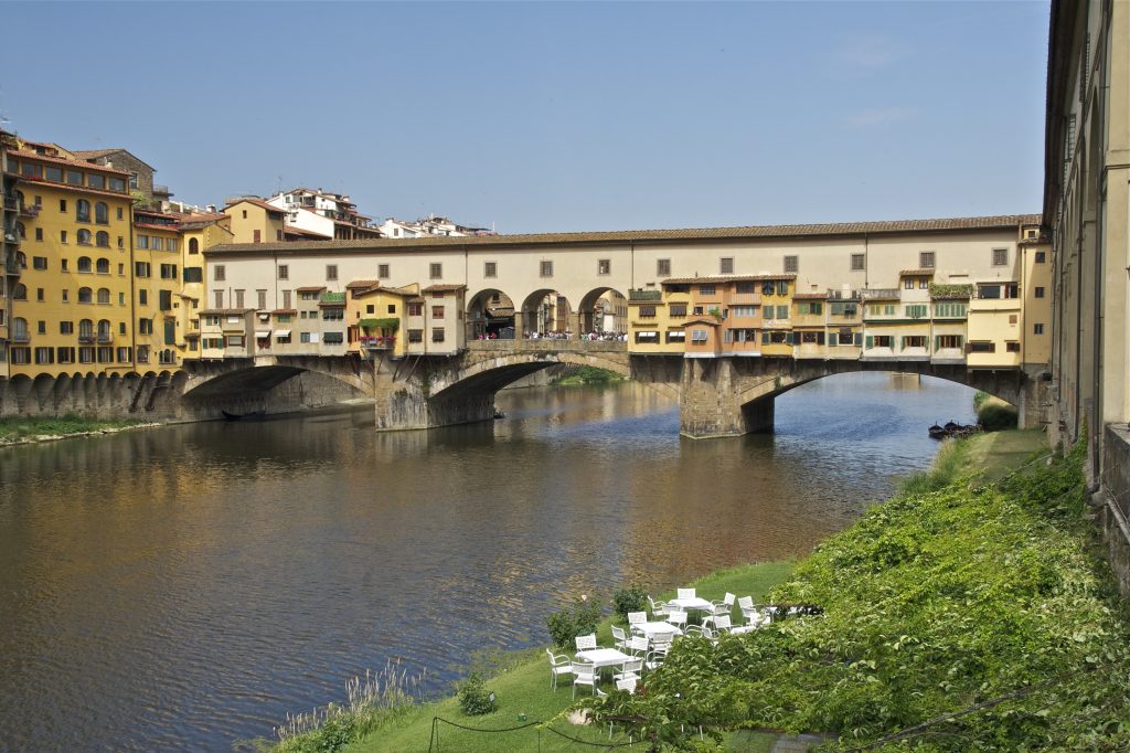 The Ponte Vecchio is a unique medieval bridge because it has shops and other buildings built on top of it.