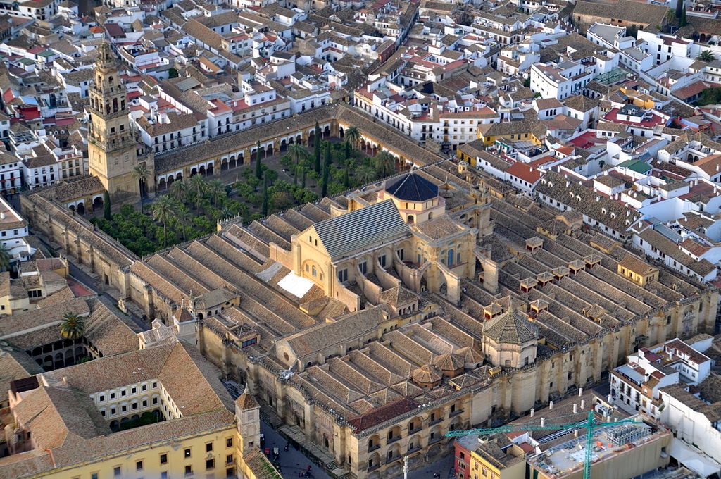 The Renaissance and Baroque architecture of the Cathedral of Cordoba greatly contrast the traditional Moorish Architecture of the Mezquita in Spain 