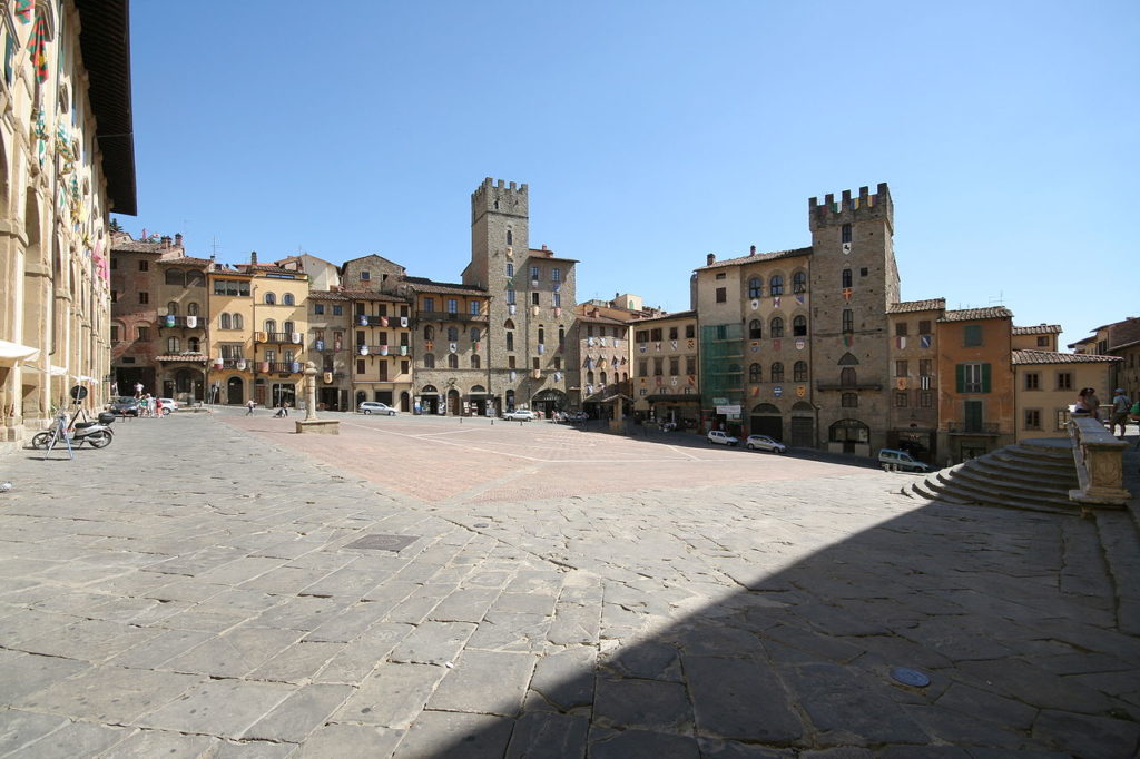 Arezzo is a city in Tuscany that is home to the famous Piazza Grande. 