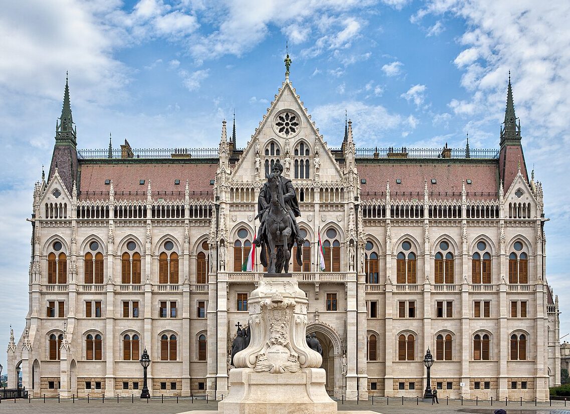 The Hungarian Parliament Buildings is a work of Gothic Revival Architecture overlooking the Danube River in Budapest. 